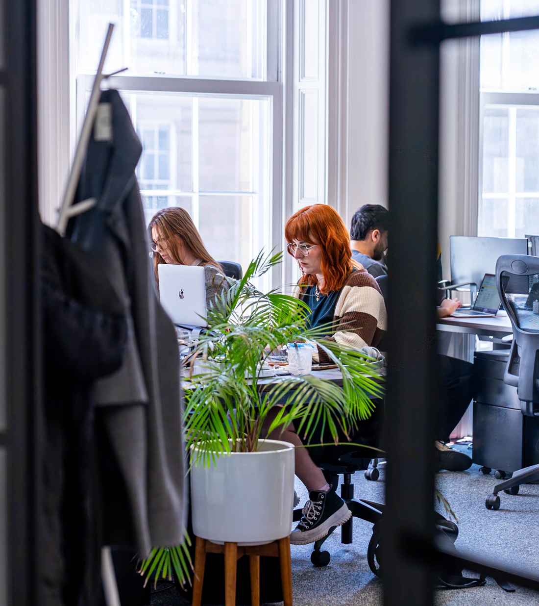 Visualsoft team collaborating in our digital marketing agency office