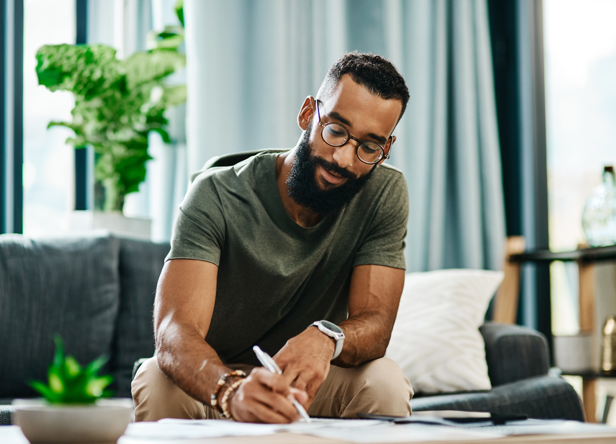 Shopify support specialist drawing provides support documents working at his desk.